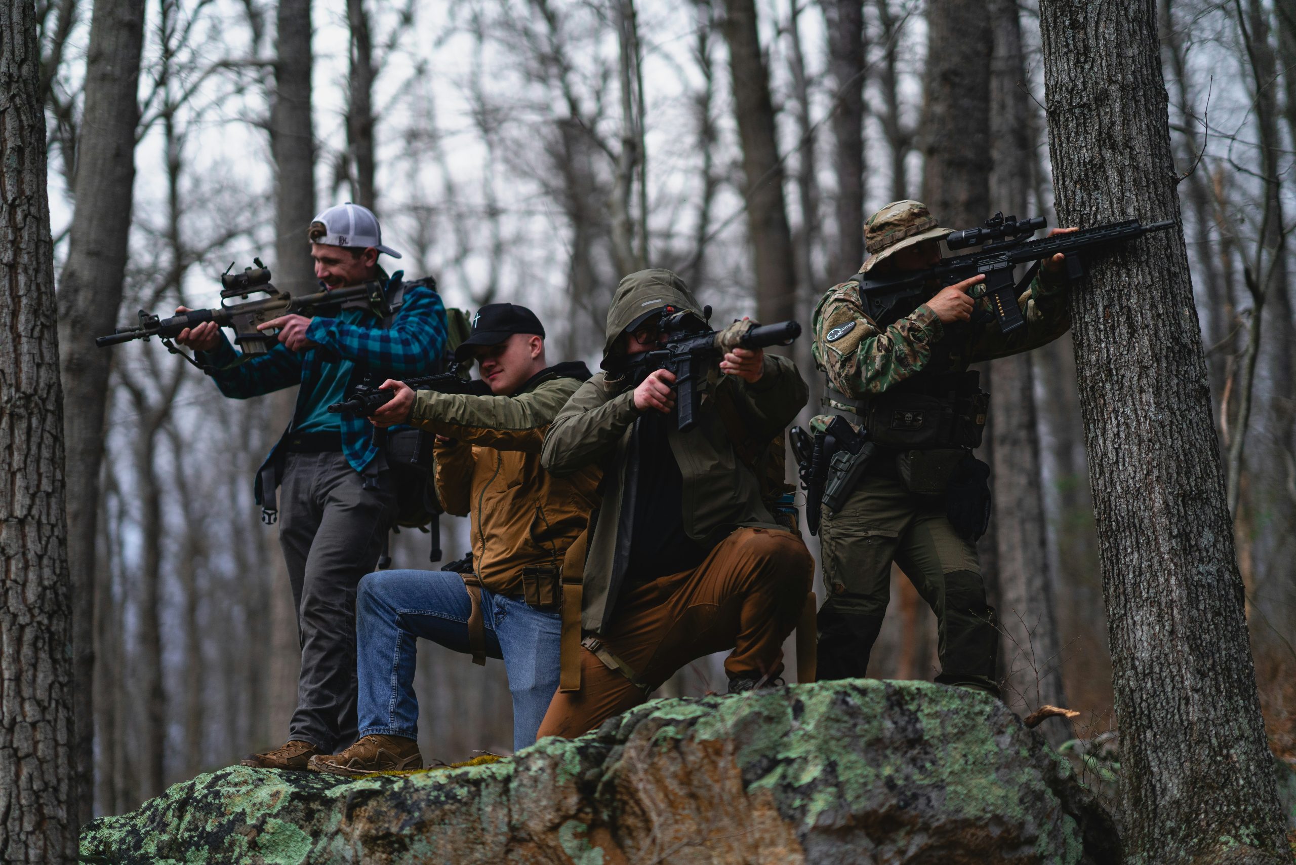 Four hunters at a Kansas guided hunting lodge, dressed in camouflage and outdoor gear.